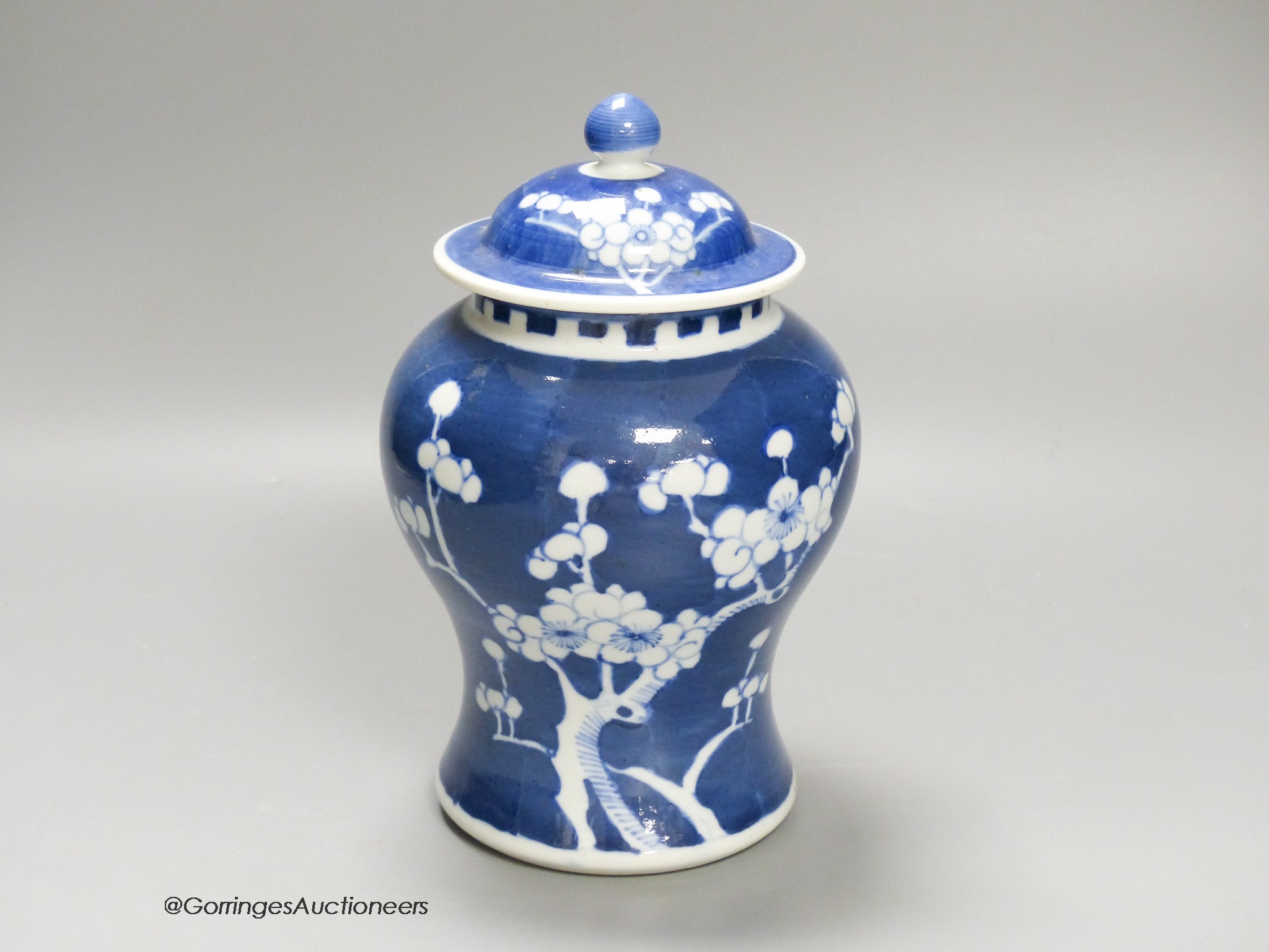 A Chinese blue and white 'prunus' jar and cover, height 22cm